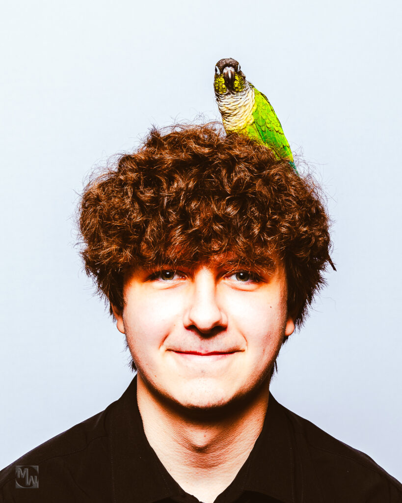 Man with bird in hair