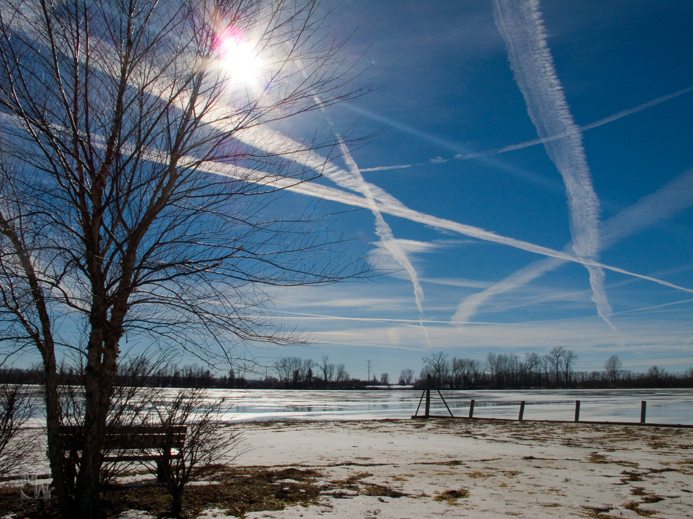 con trails and winter sky