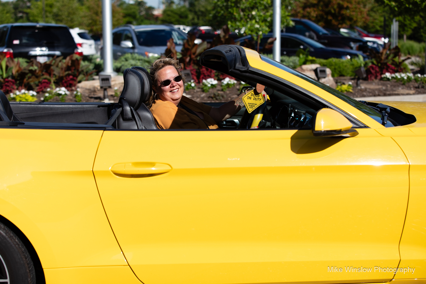 woman in yellow mustang