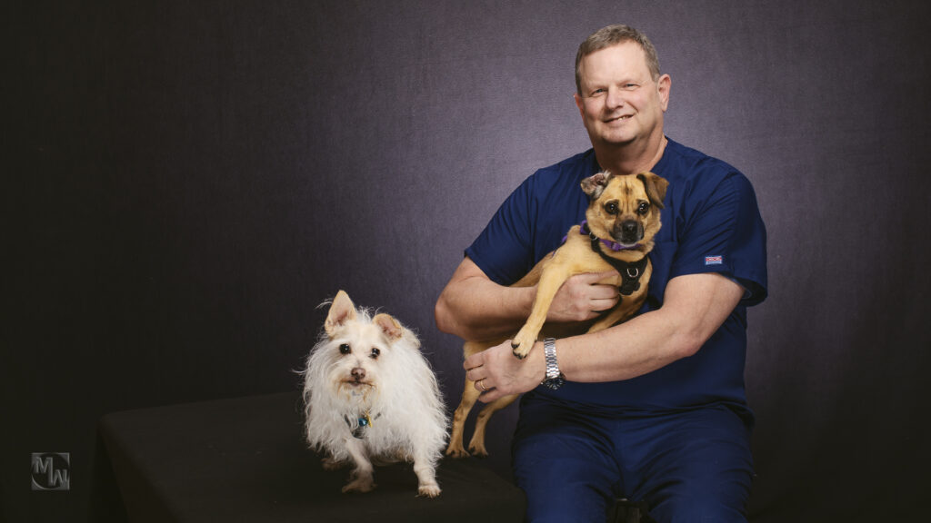 veterinarian with 2 dogs