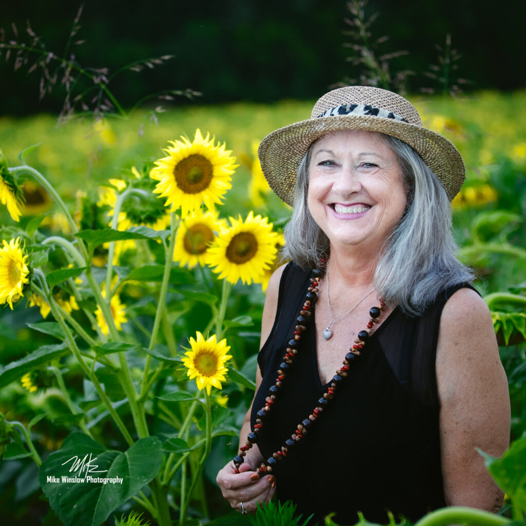 woman in sunflower field