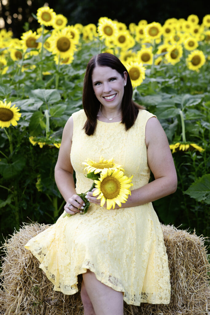 woman in sunflower field